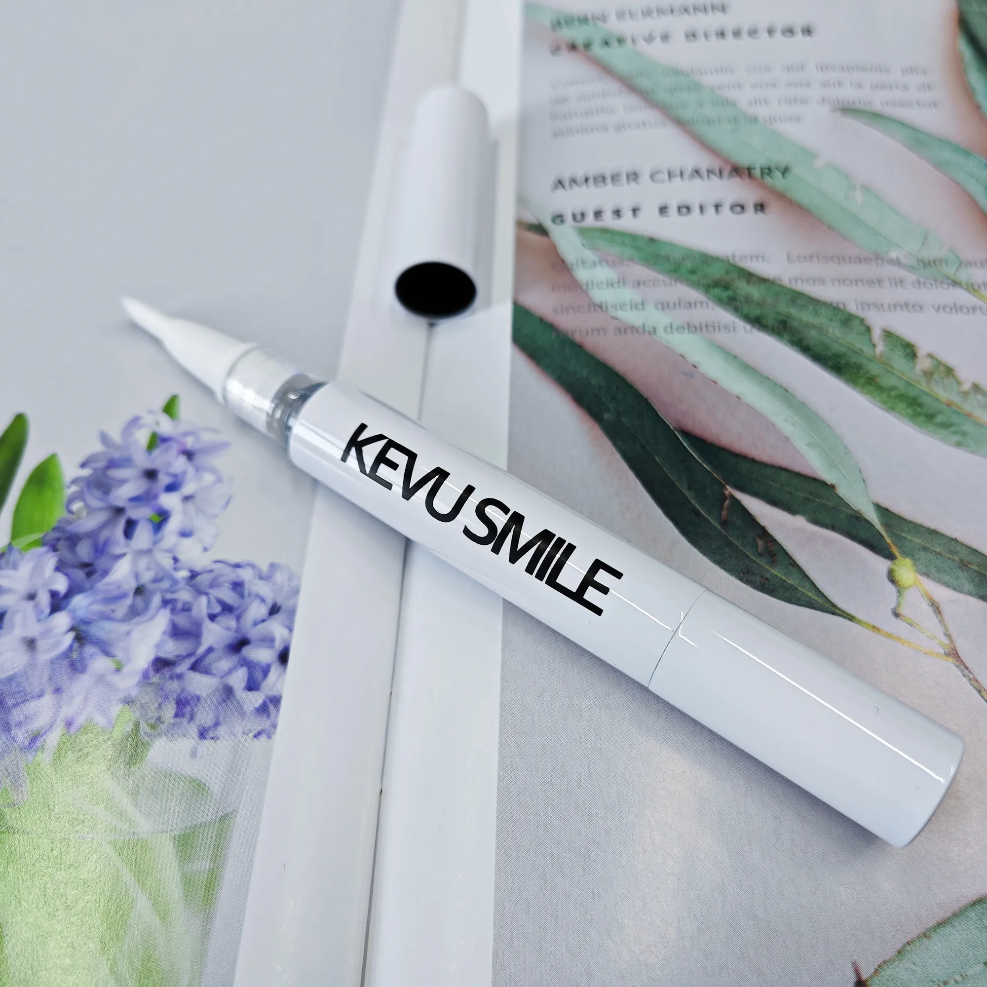 11-kevu-smile-whitening-pen-flat-lay-on-magazine