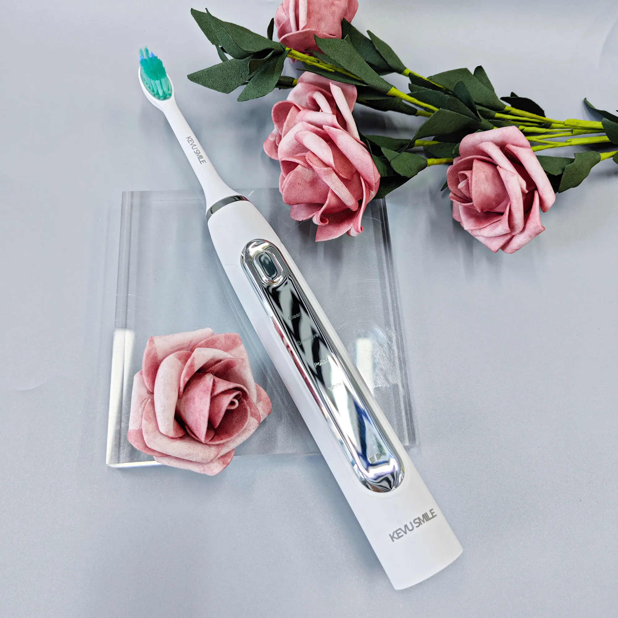 2-kevu-smile-electric-toothbrush-with-charger-and-roses